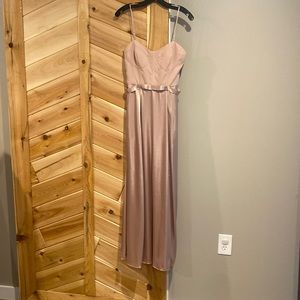 Bridesmaids dress. Originally size 8 but altered to fit me. 5’2 126lbs. New.